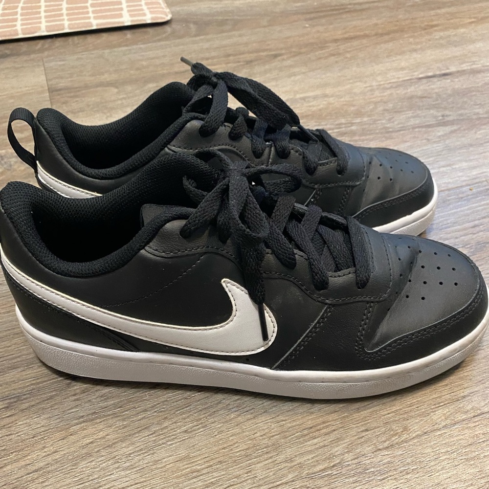 NIKE black sneaker w/ white swoosh